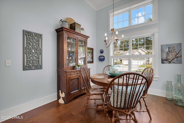 33 Paxton Cir, Bluffton, SC 29910 - dining space with crown molding, baseboards, a notable chandelier, and dark wood-style floors