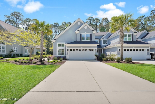 33 Paxton Cir, Bluffton, SC 29910 - traditional-style home with a front yard, an attached garage, stucco siding, and concrete driveway