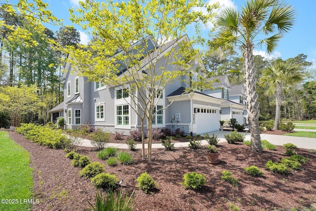 33 Paxton Cir, Bluffton, SC 29910 - view of front of property with a garage, driveway, and stucco siding