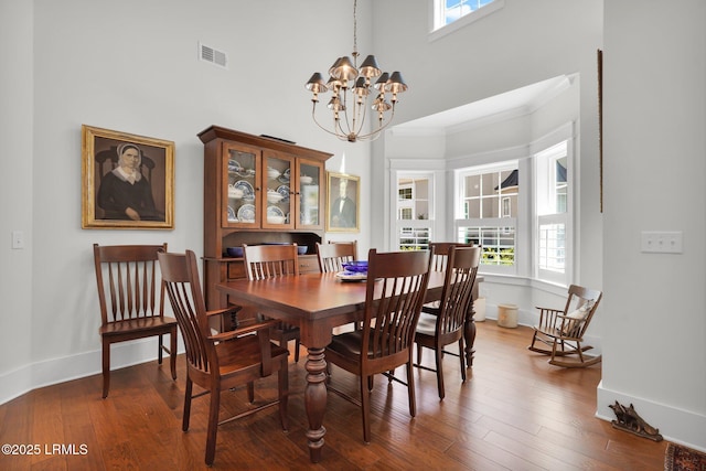 33 Paxton Cir, Bluffton, SC 29910 - dining room with visible vents, baseboards, a notable chandelier, and wood finished floors