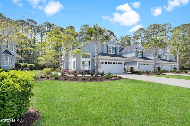 33 Paxton Cir, Bluffton, SC 29910 - view of front of home with driveway, stucco siding, an attached garage, and a front lawn