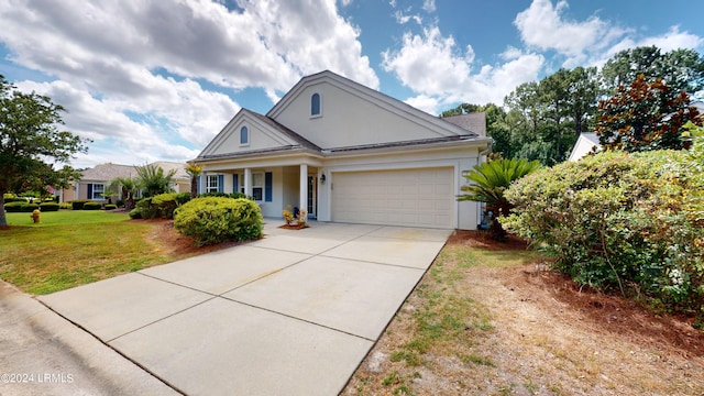 view of front of house with a garage and a front lawn