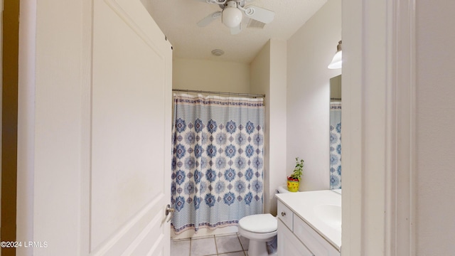 bathroom with curtained shower, vanity, ceiling fan, toilet, and tile patterned floors