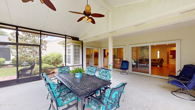 sunroom / solarium with ceiling fan and lofted ceiling