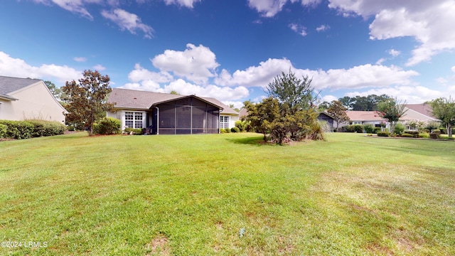 view of yard with a sunroom