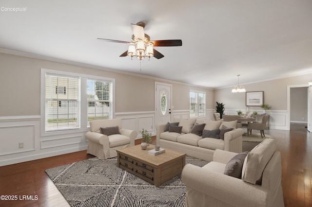 41 Able St, Bluffton, SC 29910 - living room featuring a wainscoted wall, crown molding, wood finished floors, ceiling fan, and a decorative wall