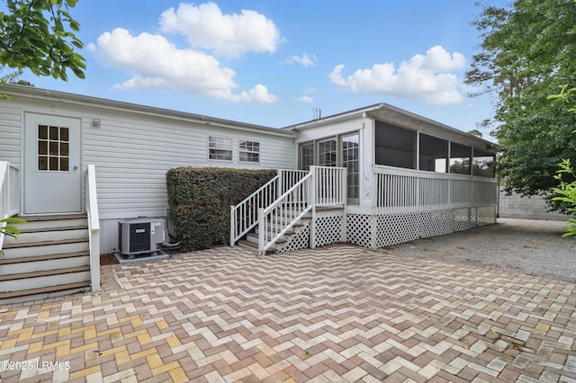 41 Able St, Bluffton, SC 29910 - rear view of property featuring cooling unit, a sunroom, and a patio