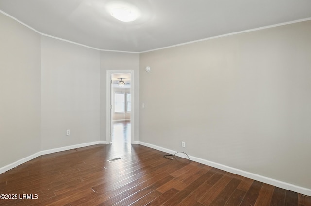 41 Able St, Bluffton, SC 29910 - spare room featuring dark wood-style flooring, baseboards, and ornamental molding