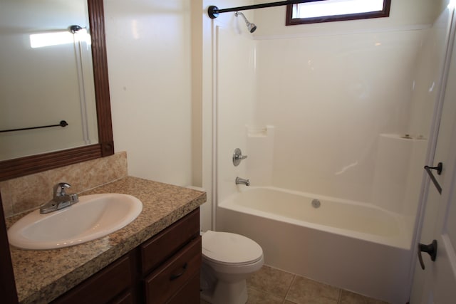 full bathroom with toilet, tile flooring, vanity, and shower / tub combination