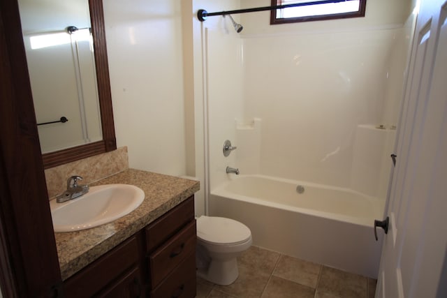 full bathroom featuring tile floors, toilet, vanity, and bathtub / shower combination