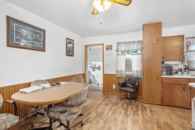 dining area featuring ceiling fan and light wood-type flooring