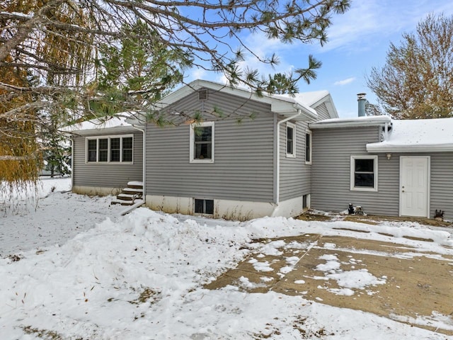 view of snow covered house