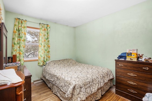 bedroom with light hardwood / wood-style flooring