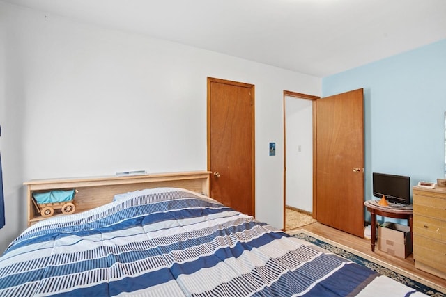 bedroom with light hardwood / wood-style flooring