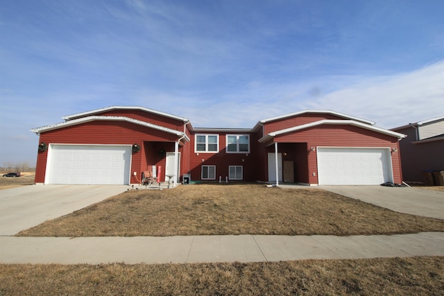 single story home with a front yard and a garage