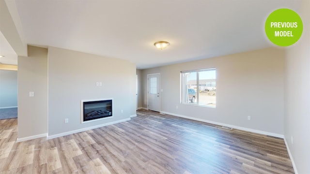 unfurnished living room featuring light hardwood / wood-style floors