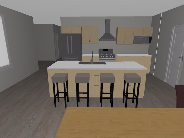 kitchen featuring black fridge, dark hardwood / wood-style floors, an island with sink, wall chimney range hood, and sink