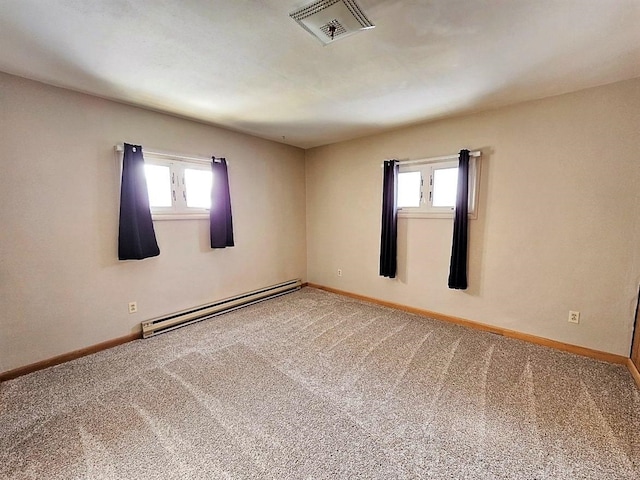 810 2nd Ave, Kenmare, ND 58746 - carpeted spare room with a healthy amount of sunlight and a baseboard radiator
