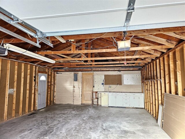 810 2nd Ave, Kenmare, ND 58746 - garage with a garage door opener