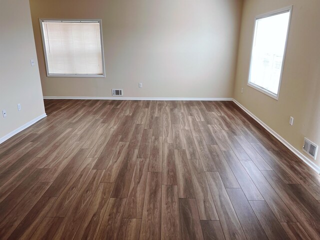 empty room featuring dark hardwood / wood-style floors