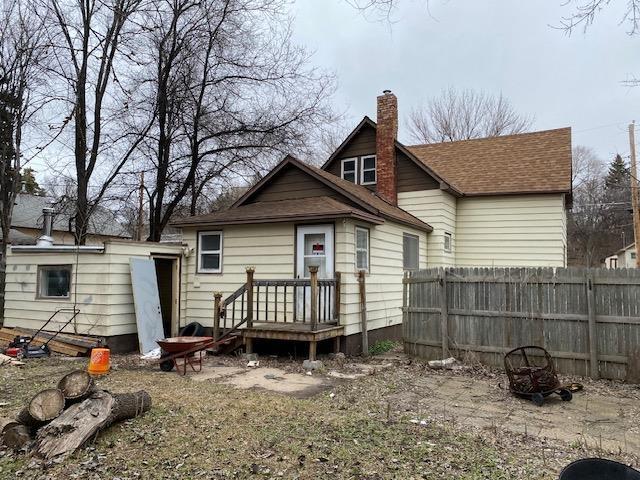 rear view of house with a fire pit