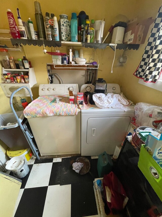 clothes washing area featuring separate washer and dryer