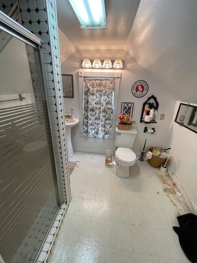 bathroom featuring tile floors, a textured ceiling, lofted ceiling, and toilet