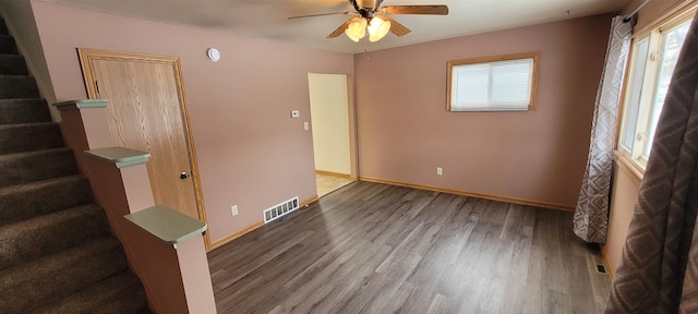 empty room featuring ceiling fan and wood-type flooring