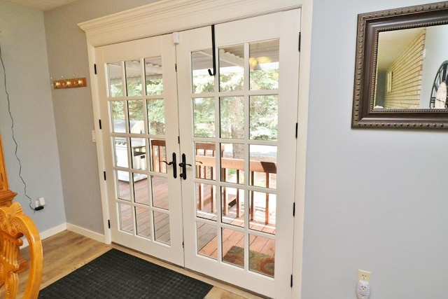 entryway featuring french doors and light hardwood / wood-style flooring