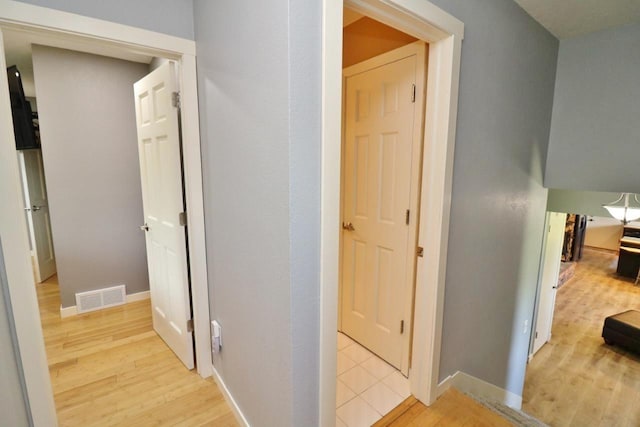 hall featuring light hardwood / wood-style floors