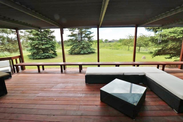 wooden deck featuring outdoor lounge area and a yard