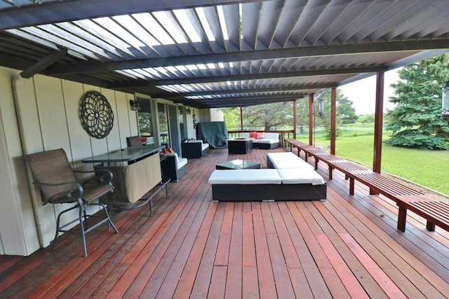 wooden deck featuring outdoor lounge area and a yard