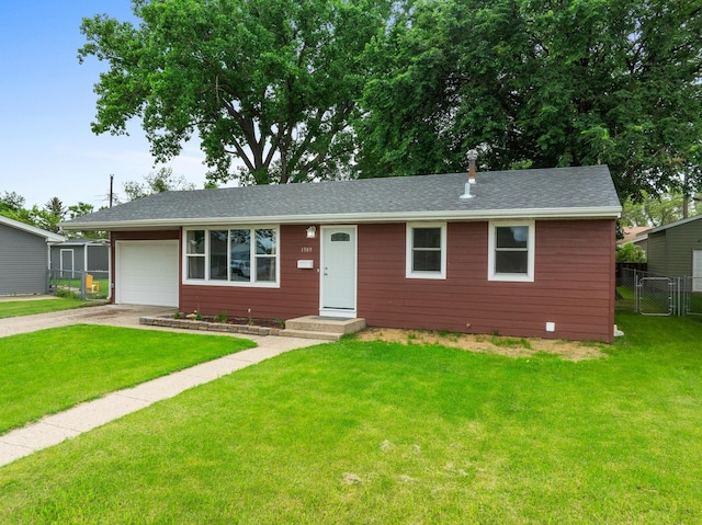 ranch-style home featuring a front yard and a garage