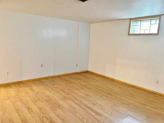 empty room with light hardwood / wood-style floors