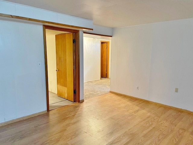 unfurnished room with light hardwood / wood-style floors