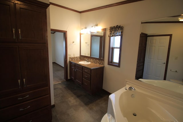 bathroom featuring vanity, crown molding, and a tub