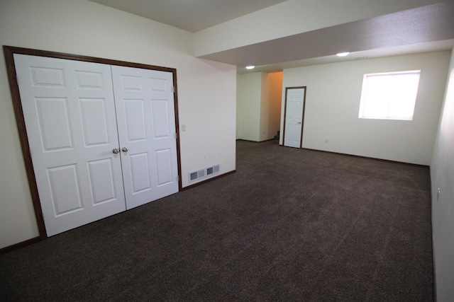 interior space with dark carpet