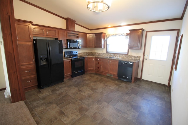 kitchen featuring lofted ceiling, an inviting chandelier, black appliances, crown molding, and sink