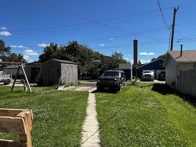 view of yard featuring a storage unit