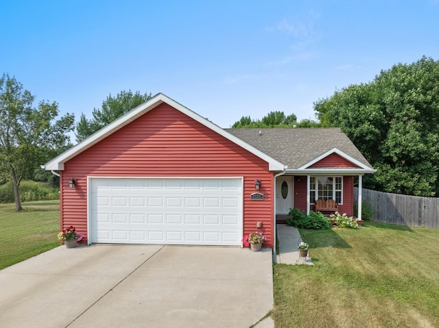 ranch-style house featuring a garage and a front yard