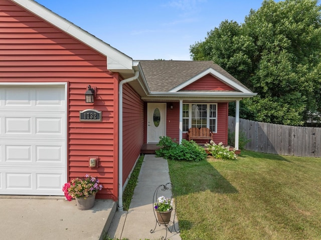 view of front of property featuring a garage and a front lawn