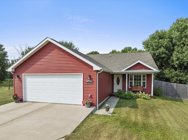 single story home with a garage and a front yard