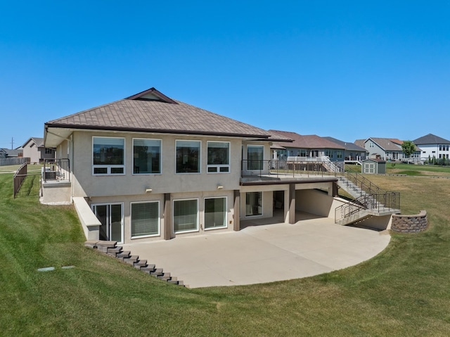 rear view of property with a patio area and a yard