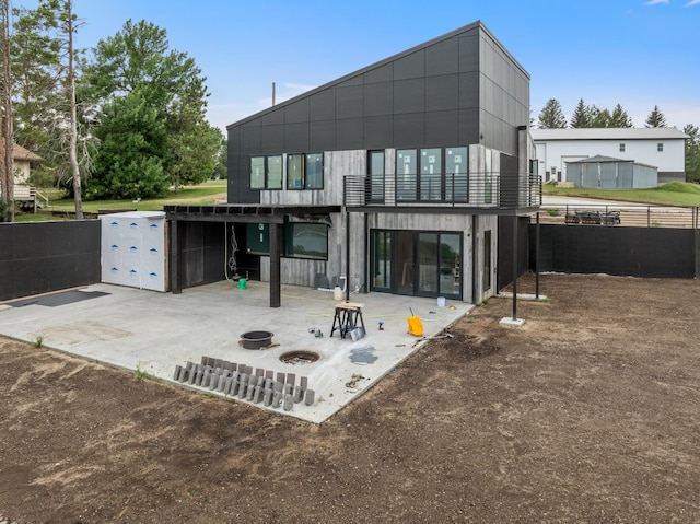 back of property with a patio