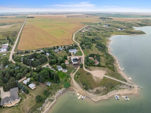 aerial view with a rural view and a water view