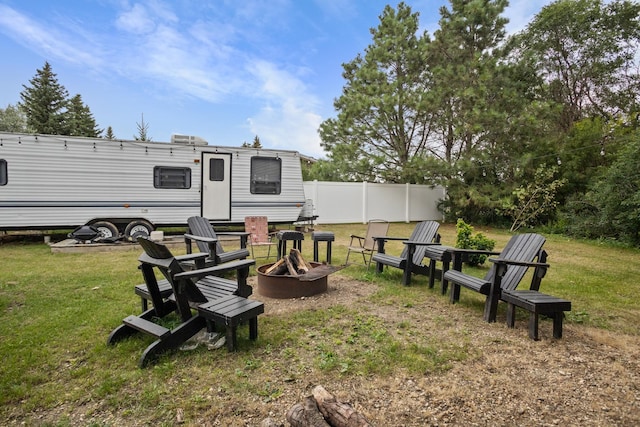 view of yard with an outdoor fire pit