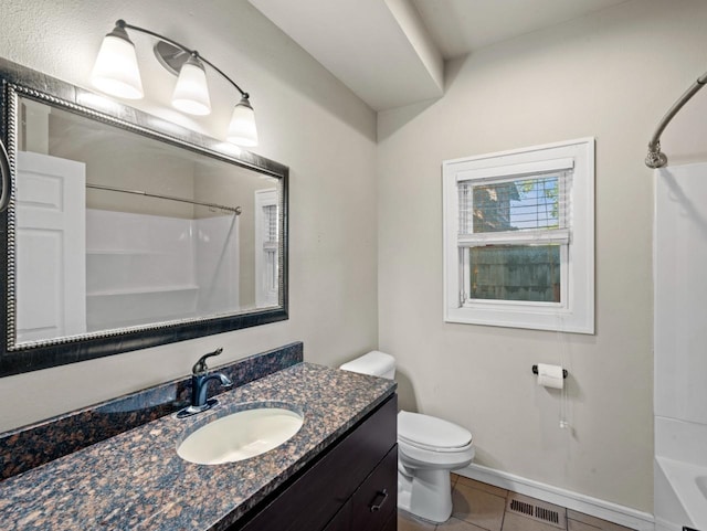 bathroom with toilet, vanity, visible vents, tub / shower combination, and tile patterned floors