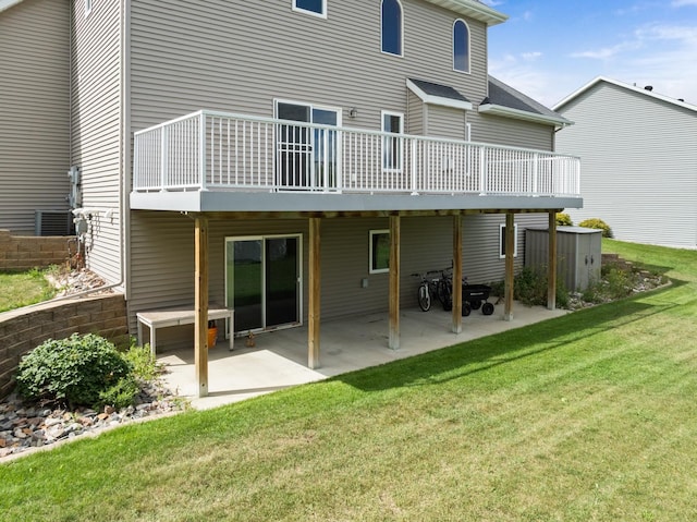 rear view of house featuring a yard and a patio area