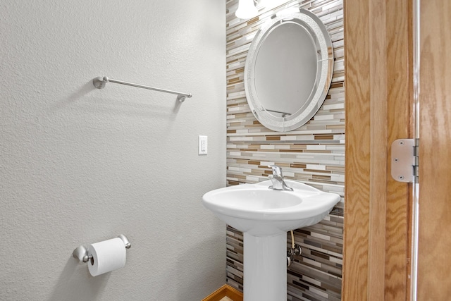 bathroom featuring decorative backsplash