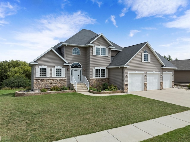 craftsman inspired home with a garage and a front lawn